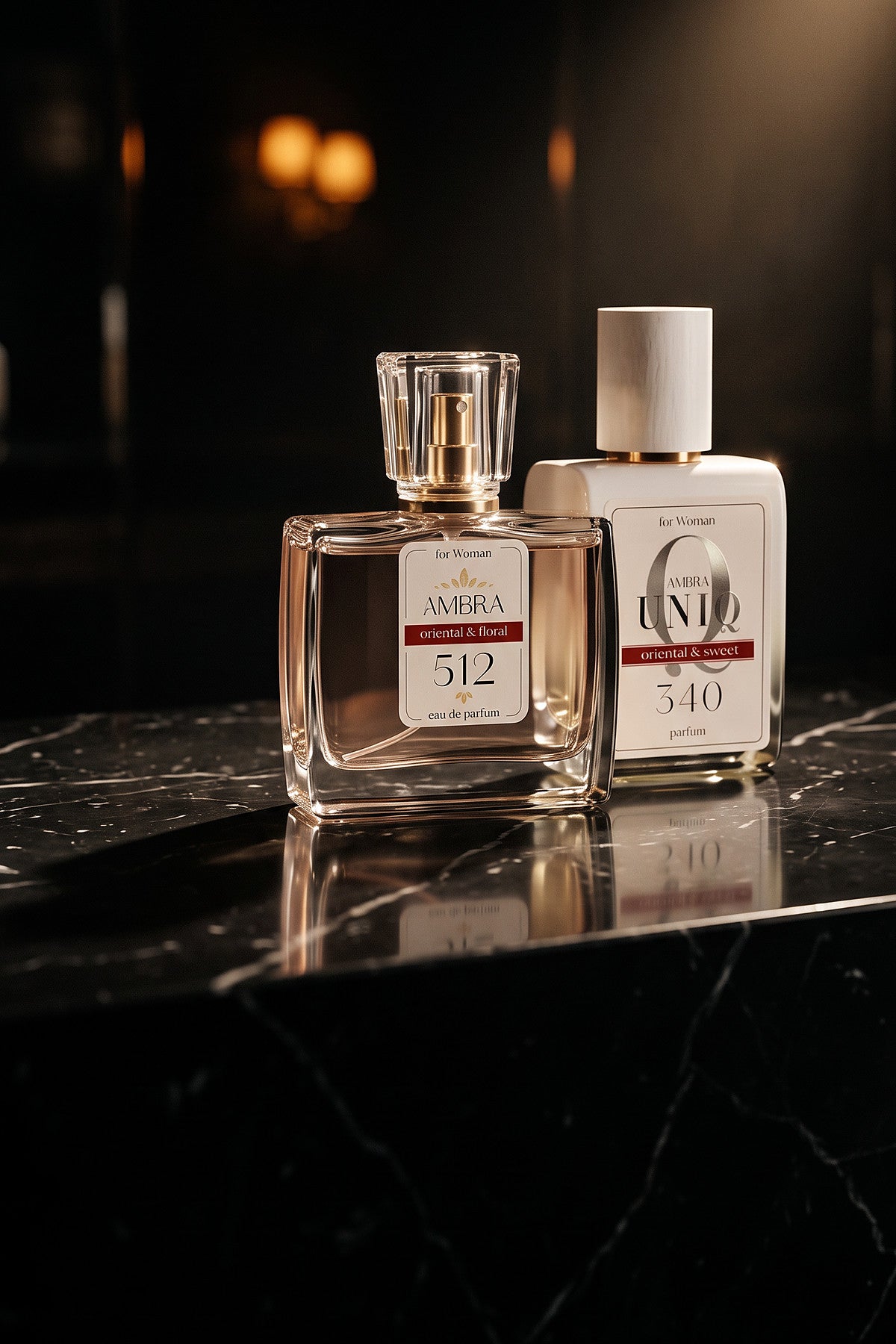 512. Perfumy Ambra Classic i 340. Perfumy Ambra UNIQ na czarnym marmurze, w ciepłym świetle